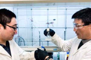 Doctors Guihua Yu and Fei Zhao work in a lab with hydrogels