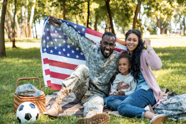 Military family with U.S. flag.